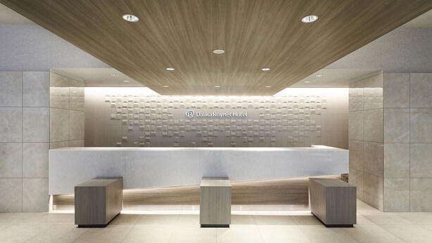 A modern reception area with a wooden ceiling, a reception desk, and a wall with geometric patterns. - Daiwa Roynet Hotel Nagoya Shinkansenguchi (Nagoya)