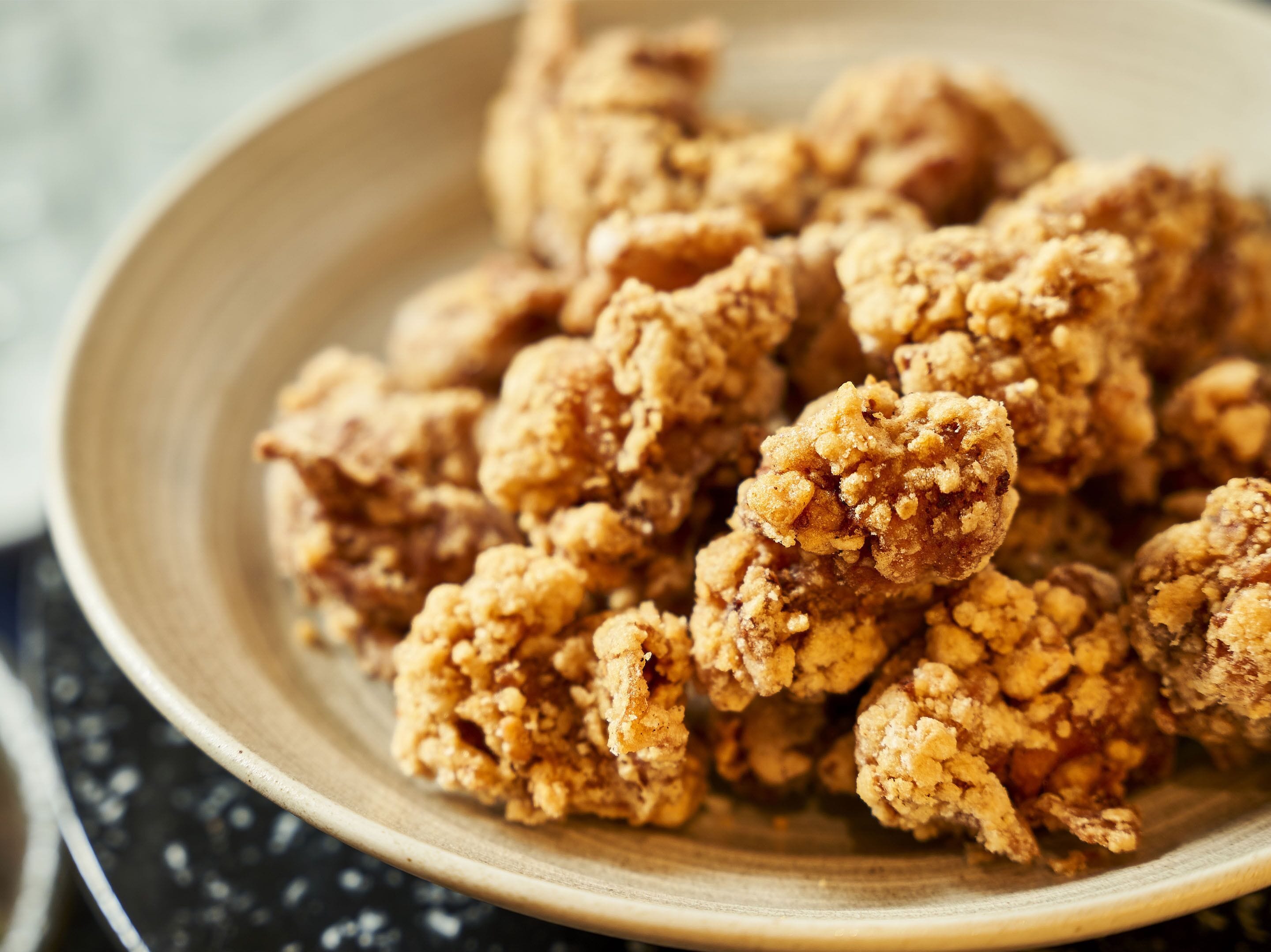 A plate of fried chicken pieces.