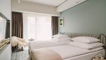 Premium bedding, down duvets, pillow-top beds, in-room safe