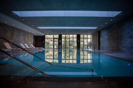 Indoor pool, open 9:00 AM to 9:00 PM, pool loungers. Clarion Paris CDG Airport