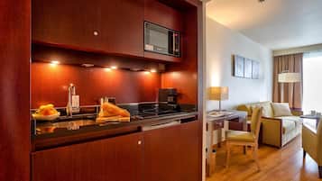 Fridge, microwave, stovetop, coffee/tea maker