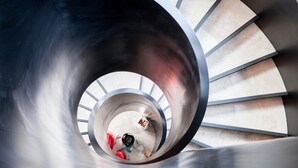 A spiral staircase with a metallic finish and a view of the floor below. - Novotel Auckland Airport (Auckland)