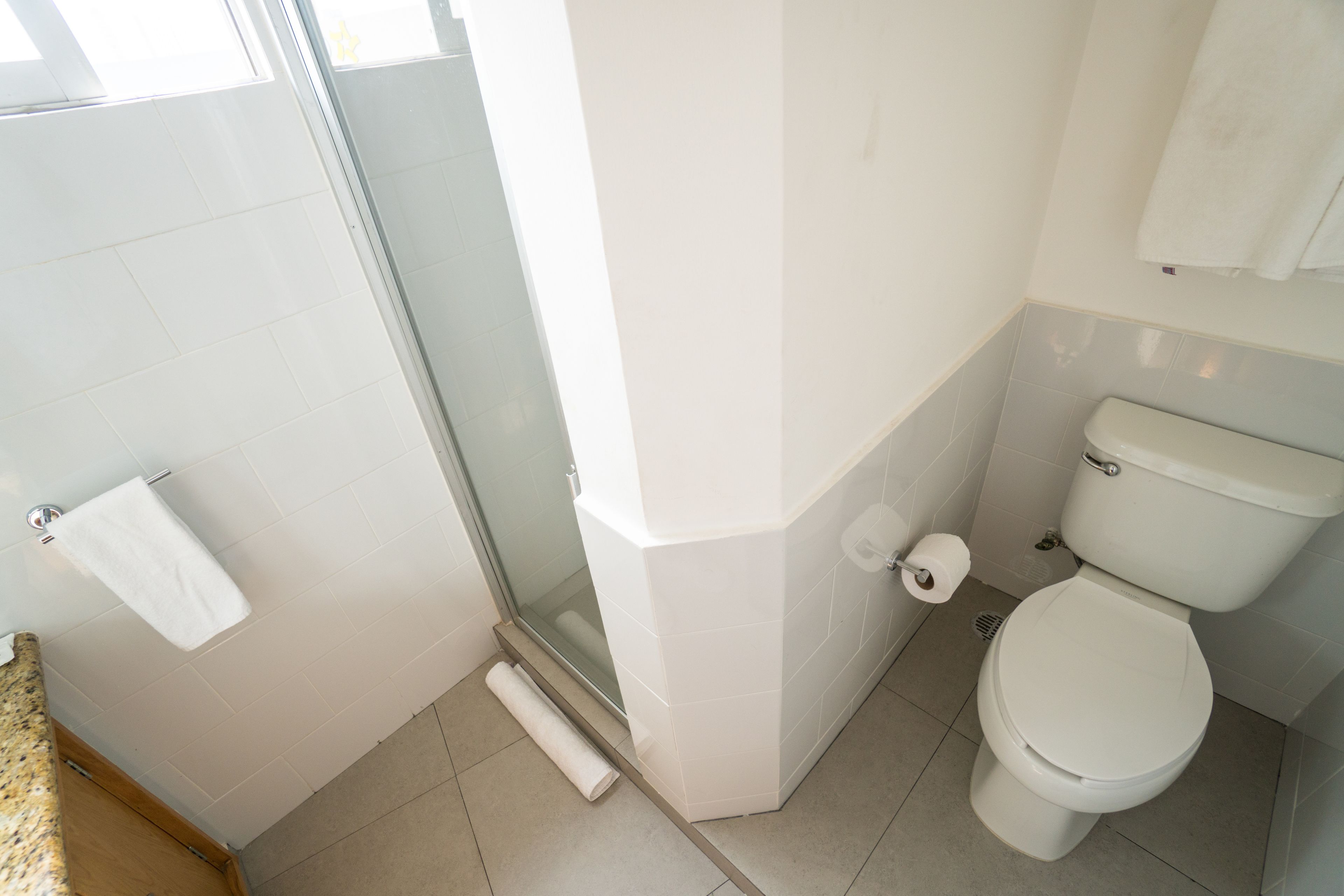 superior quadruple room, 2 double beds, tower | bathroom | shower, rainfall showerhead, towels, soap