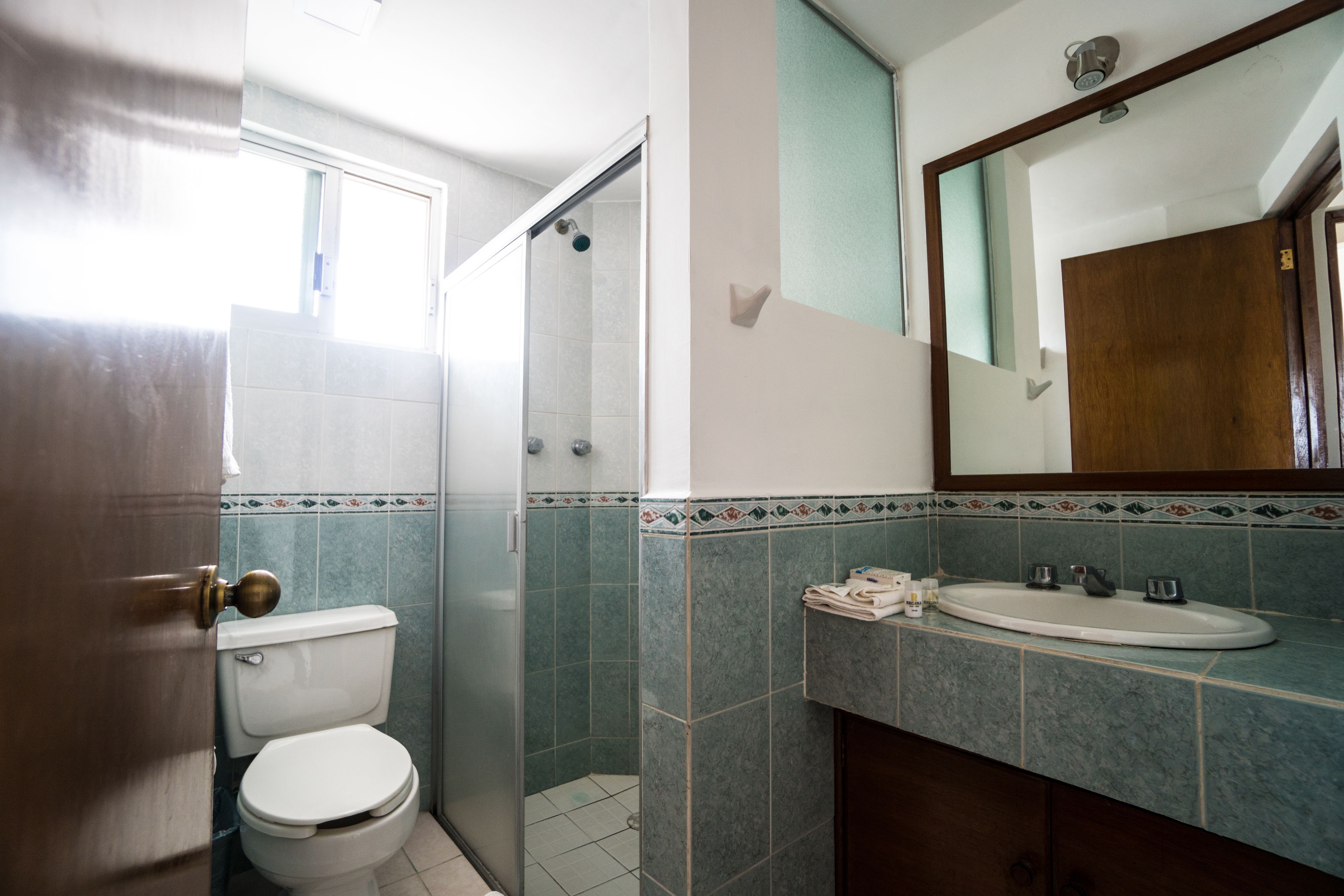 standard suite, 1 queen bed, tower | bathroom | shower, rainfall showerhead, towels, soap