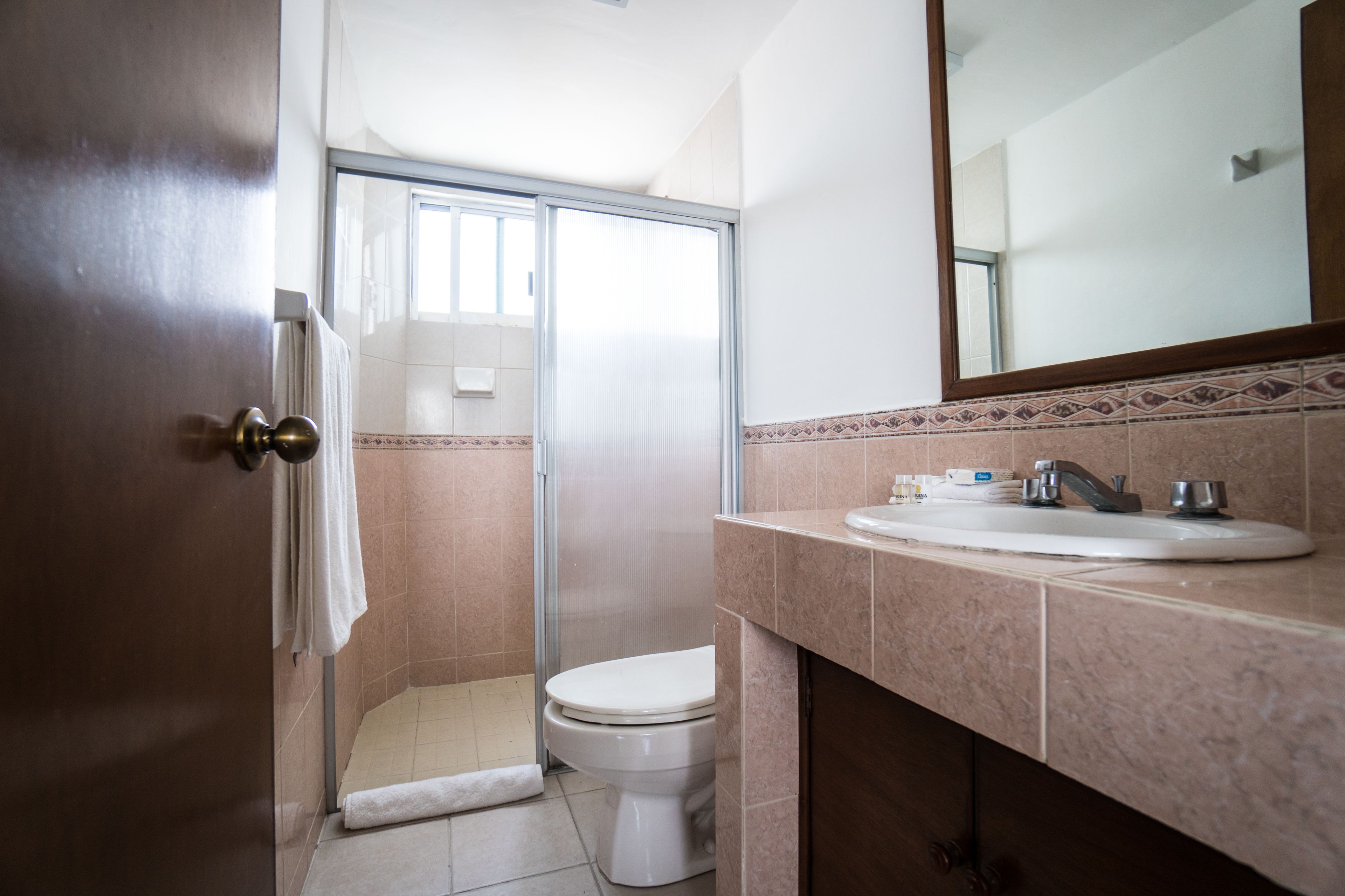 superior suite, 2 queen beds, tower | bathroom | shower, rainfall showerhead, towels, soap