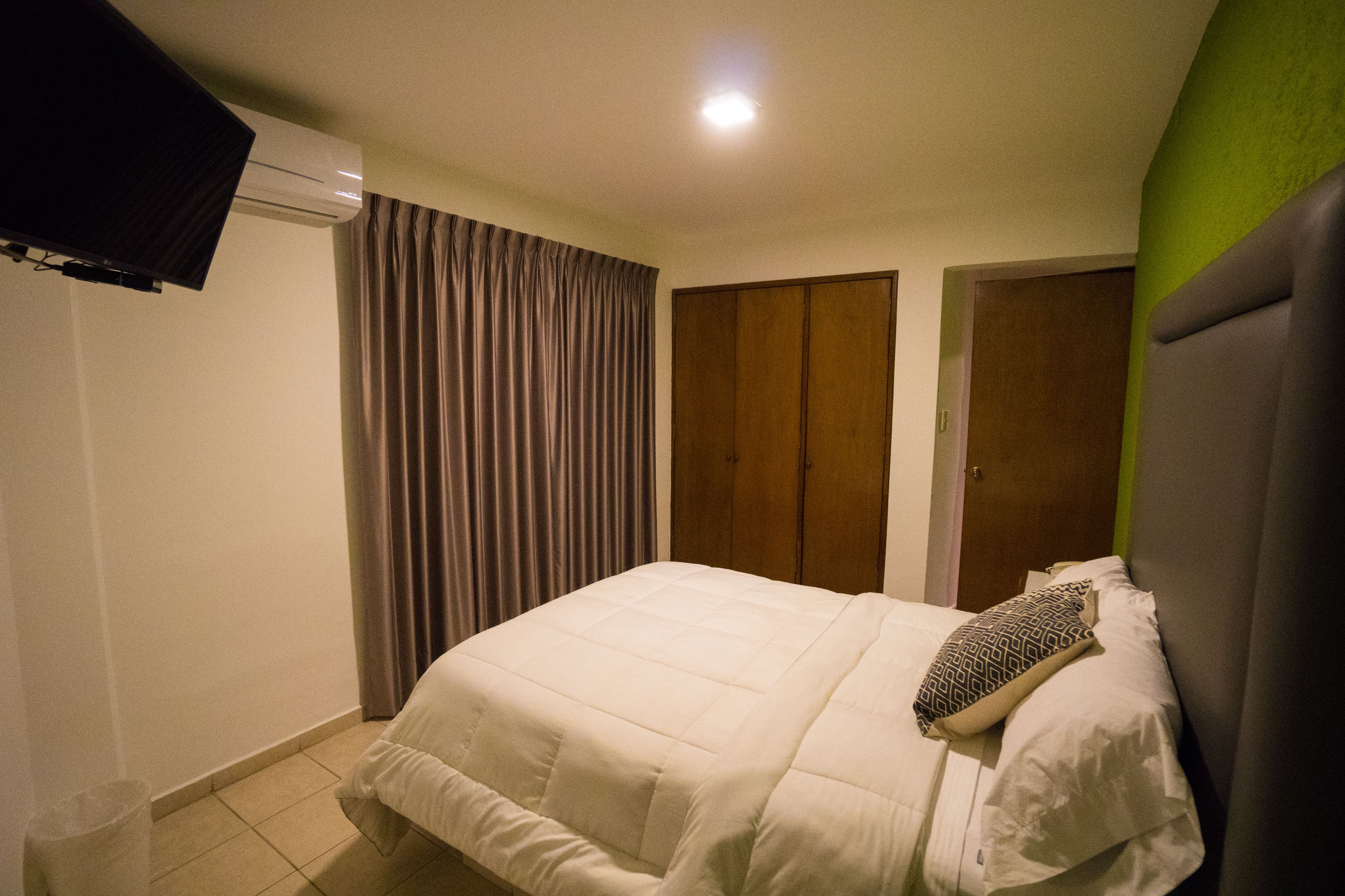 standard suite, 1 queen bed, tower | desk, laptop workspace, blackout curtains, free wifi