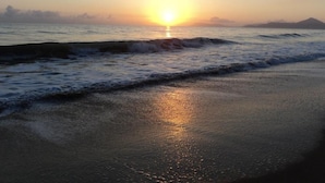 A beach scene with waves and a sunset. - The Beach Place (Yorkeys Knob)