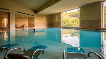 Indoor pool, seasonal outdoor pool, pool umbrellas, pool loungers