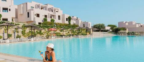Indoor pool, seasonal outdoor pool, pool umbrellas, pool loungers