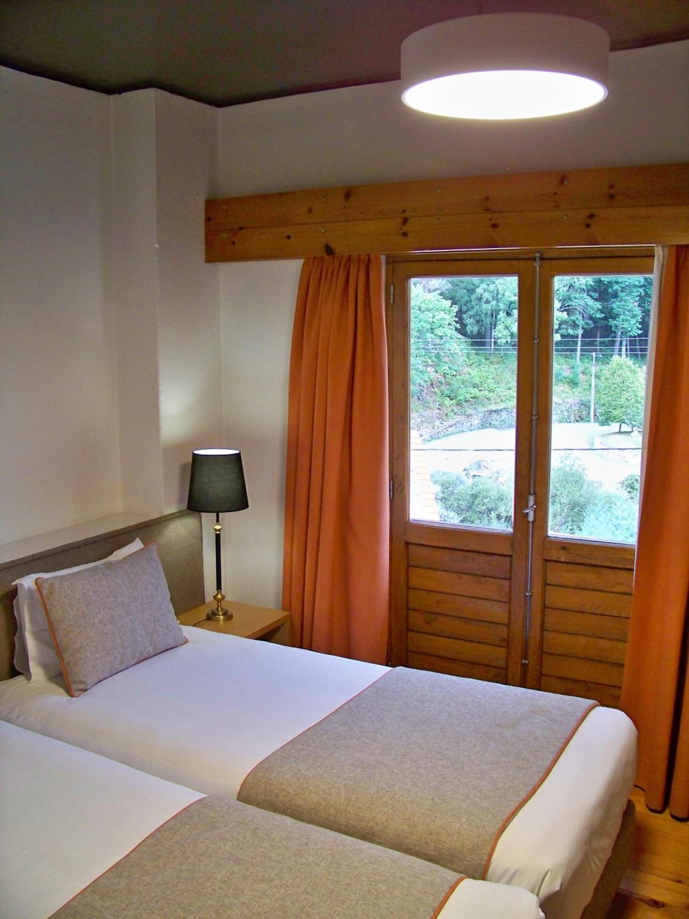 Minibar, desk, laptop workspace, blackout curtains