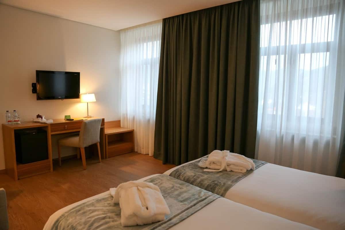 Minibar, desk, laptop workspace, blackout curtains