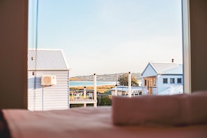 Enjoy a serene view of the coastal area from this room's large window.