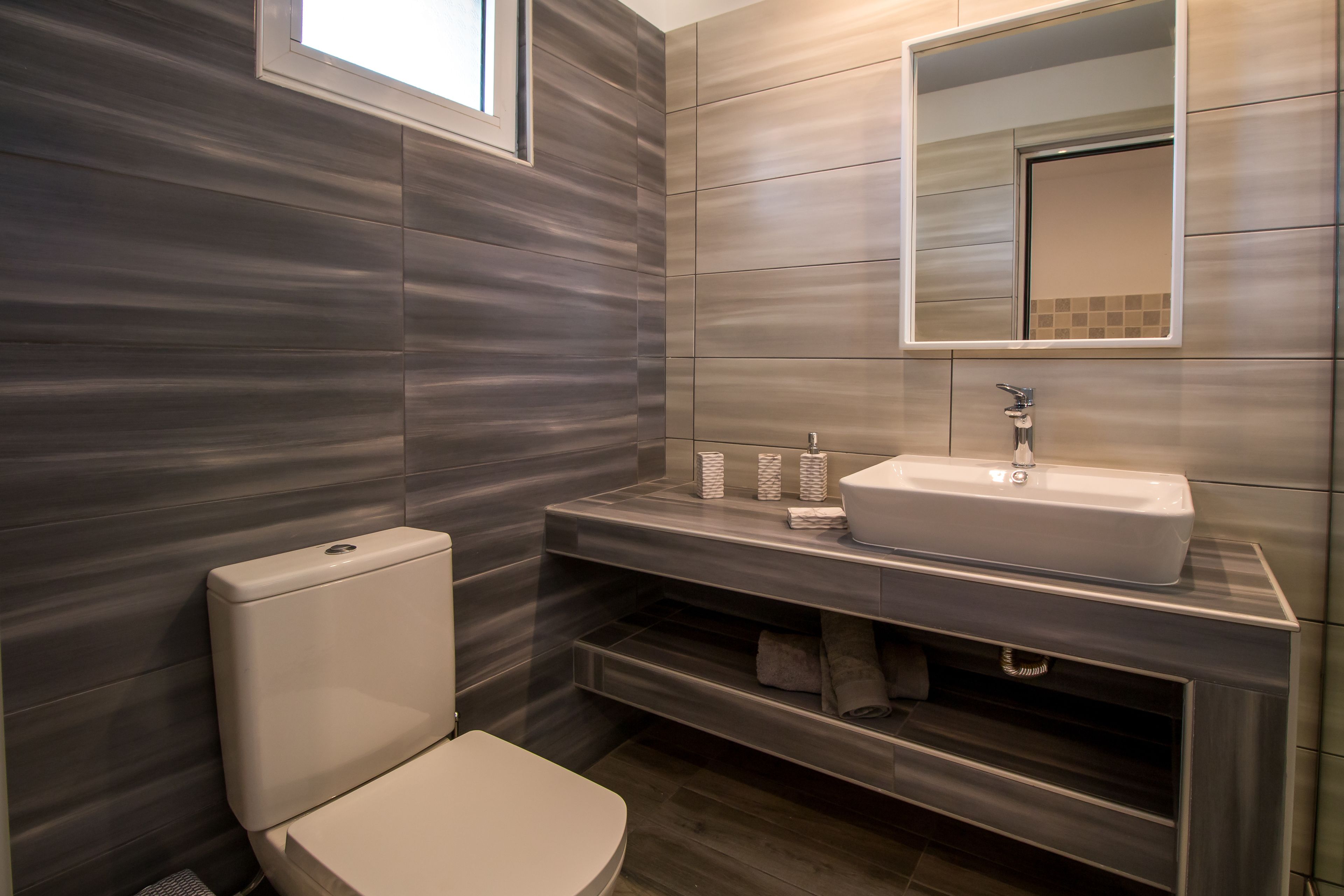 deluxe triple room | bathroom | shower, eco-friendly toiletries, hair dryer, towels