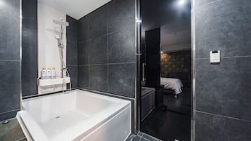 Separate tub and shower, hair dryer, bathrobes, slippers