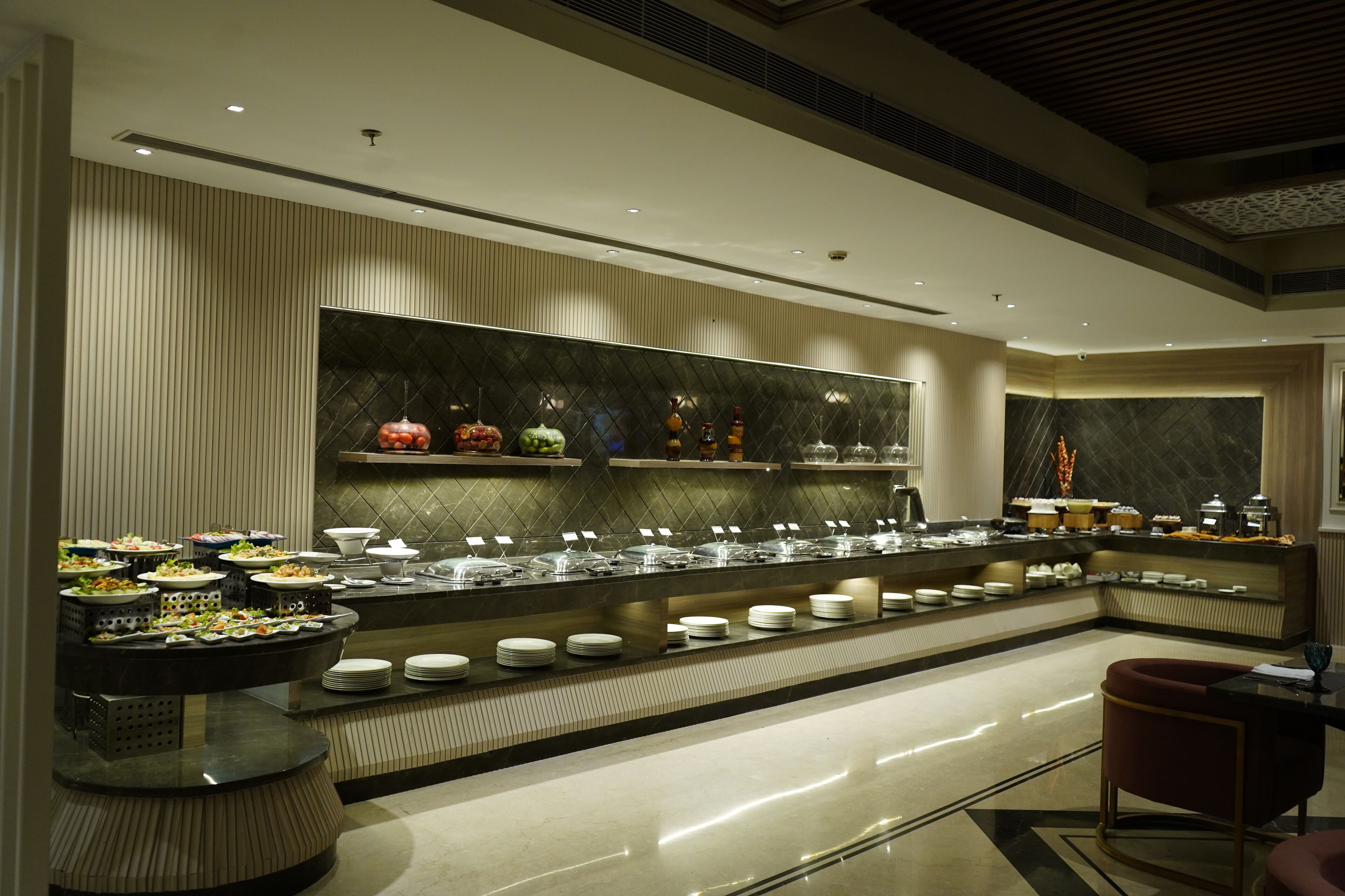A buffet setup with multiple food stations and seating areas.