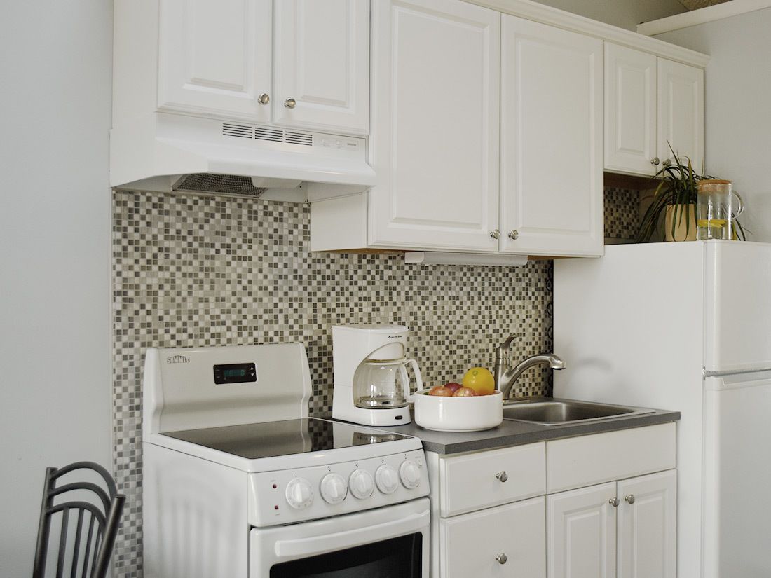 full-sized fridge, microwave, stovetop, cookware/dishes/utensils