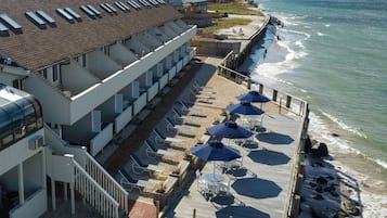 Relax on the deck with ocean views, sun loungers, and umbrellas.