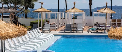 Seasonal outdoor pool, pool umbrellas, pool loungers