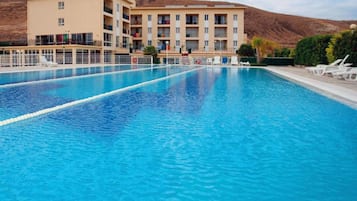 Seasonal outdoor pool, pool loungers