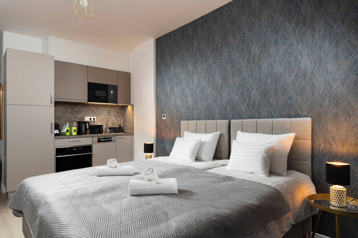 off-site studio with balcony | hypo-allergenic bedding, in-room safe, individually decorated