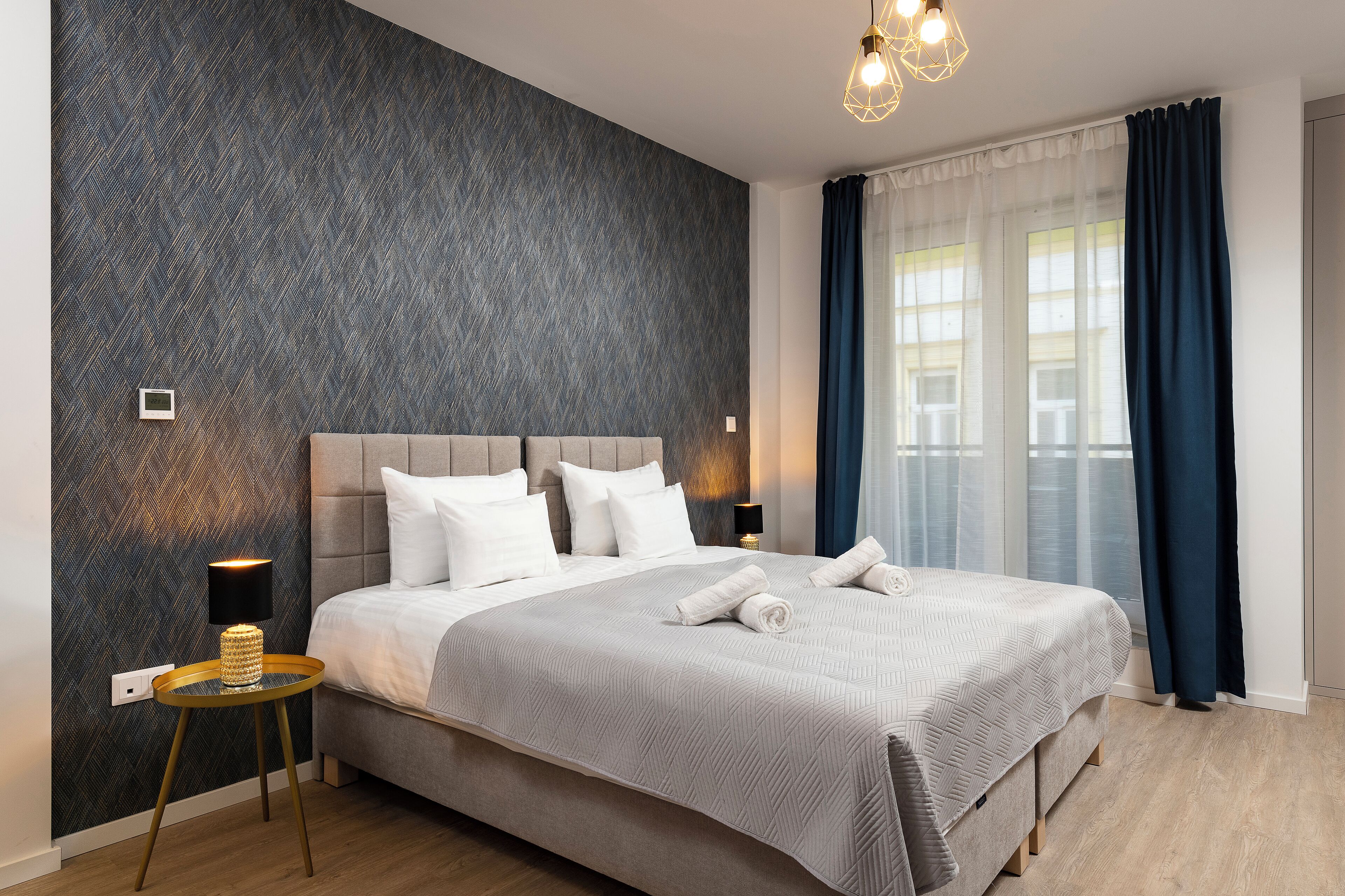 off-site studio with balcony | hypo-allergenic bedding, in-room safe, individually decorated