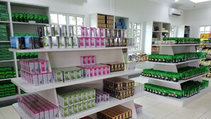 A retail store with multiple shelves stocked with various tea products. - Sabah Tea Resort (Ranau)