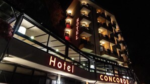 A hotel named "Concorde" with a modern architectural design, featuring multiple balconies and a prominent sign. - Hotel Concorde (Arona)