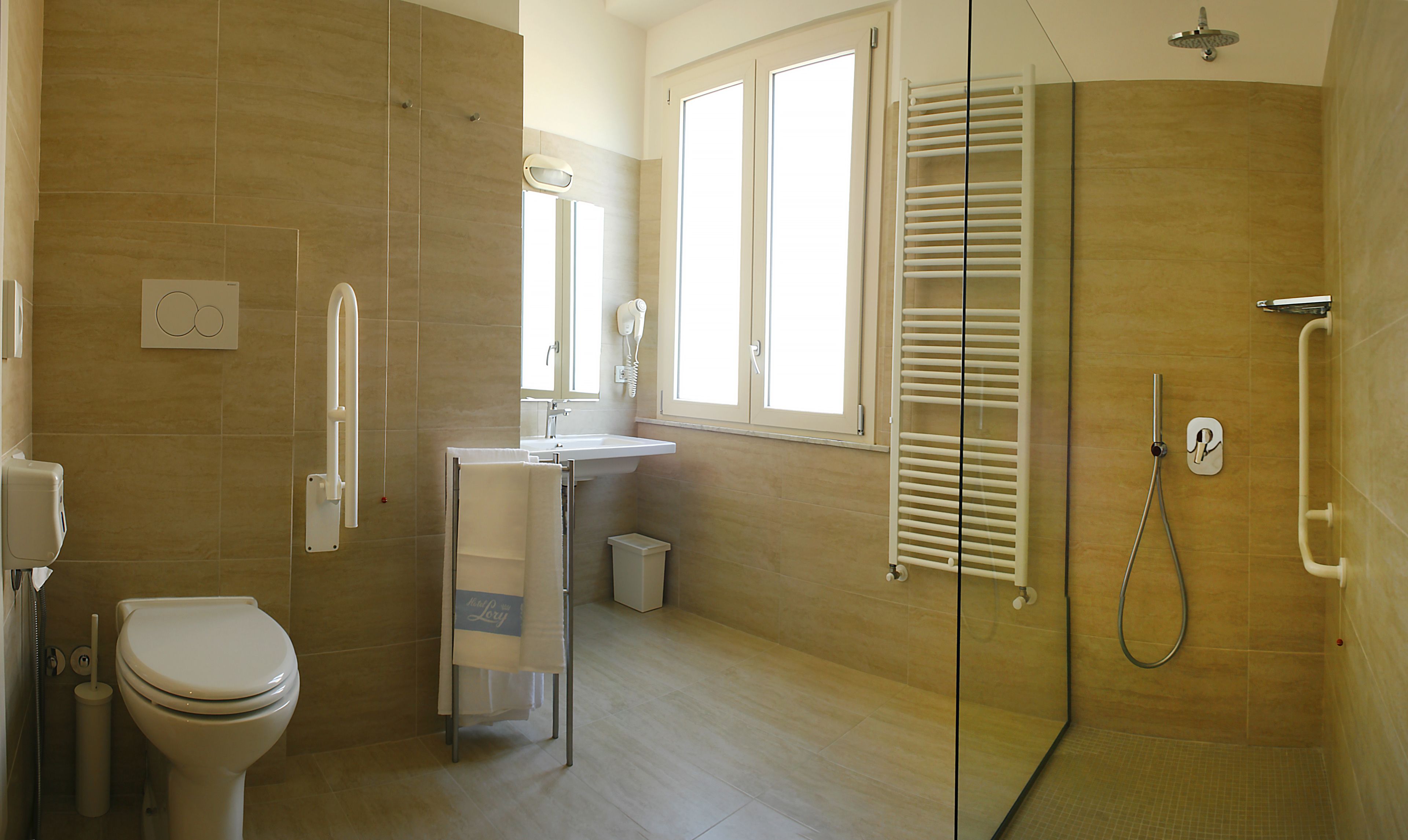 superior triple room | bathroom | rainfall showerhead, hair dryer, bidet, towels
