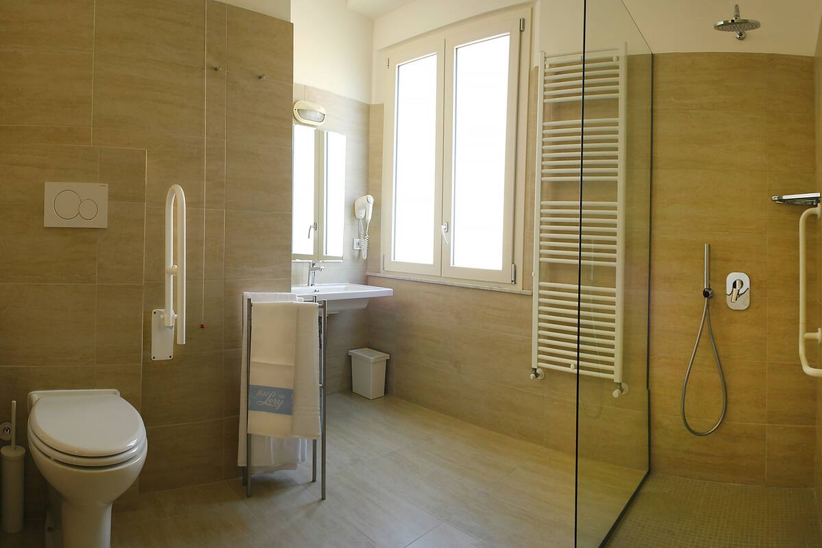 superior triple room | bathroom | rainfall showerhead, hair dryer, bidet, towels