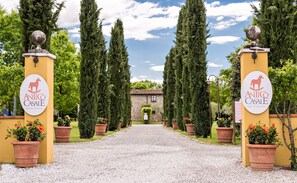 A pathway leading to a building with a sign reading "Antico Casale." - Antico Casale (Sarzana)