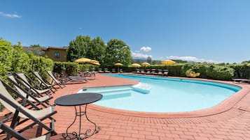 Seasonal outdoor pool, open 8:30 AM to 7:30 PM, pool umbrellas