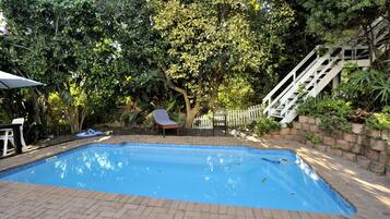 Outdoor pool, pool umbrellas, pool loungers