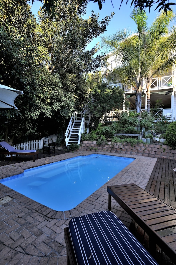 Outdoor pool, pool umbrellas, pool loungers