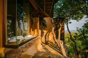 Exclusive Suite, 1 King Bed | Bathroom | Separate tub and shower, deep soaking tub, hair dryer, bathrobes