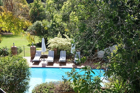 Outdoor pool, open 8:00 AM to 8:00 PM, pool umbrellas, sun loungers