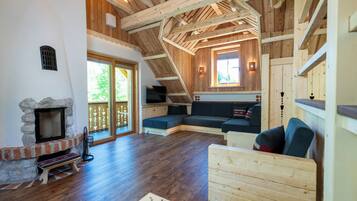 Chalet Studio SAVICA with Mountain - River View, Fireplace and Sauna | Living area | 80-cm flat-screen TV with satellite channels, TV, heated floors