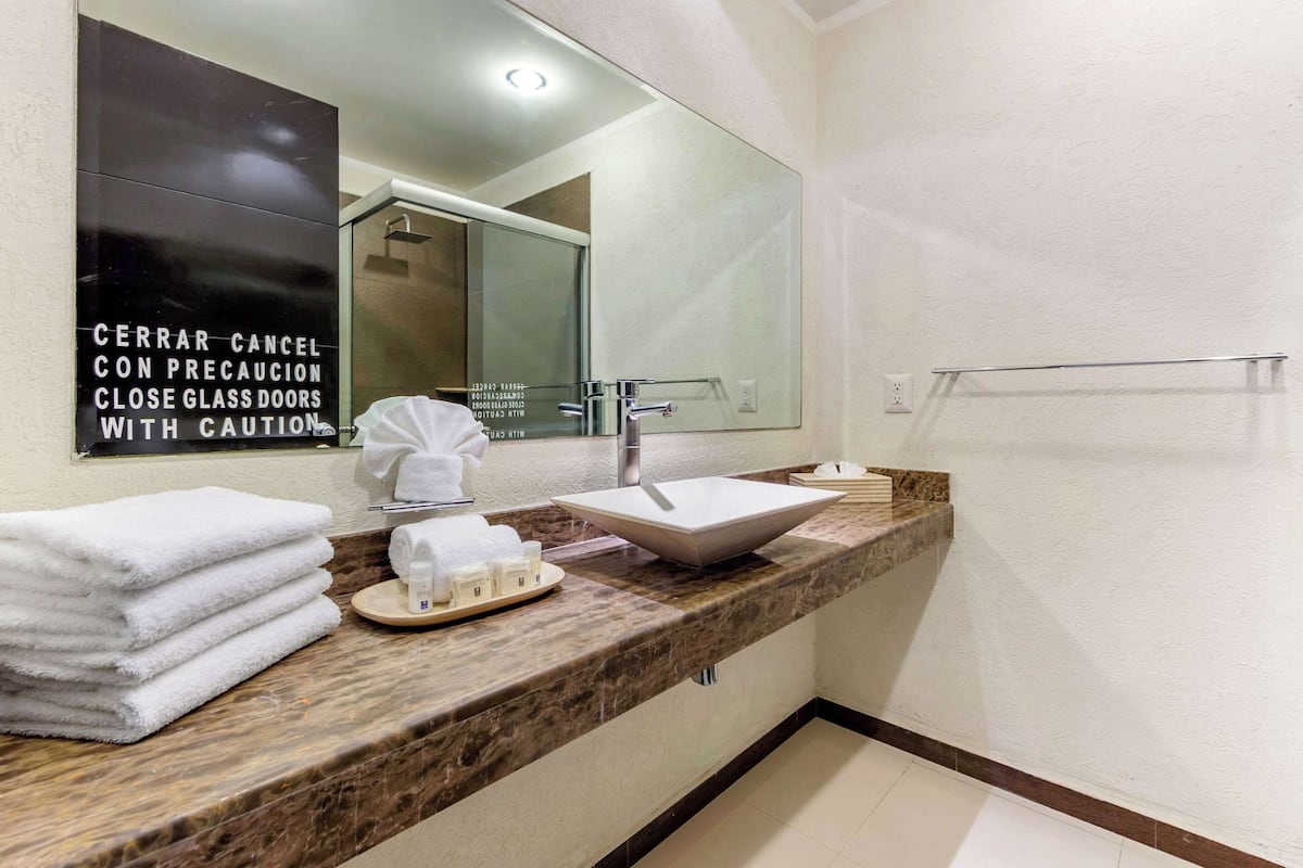 standard double room, 2 double beds, non smoking | bathroom | shower, free toiletries, hair dryer, towels