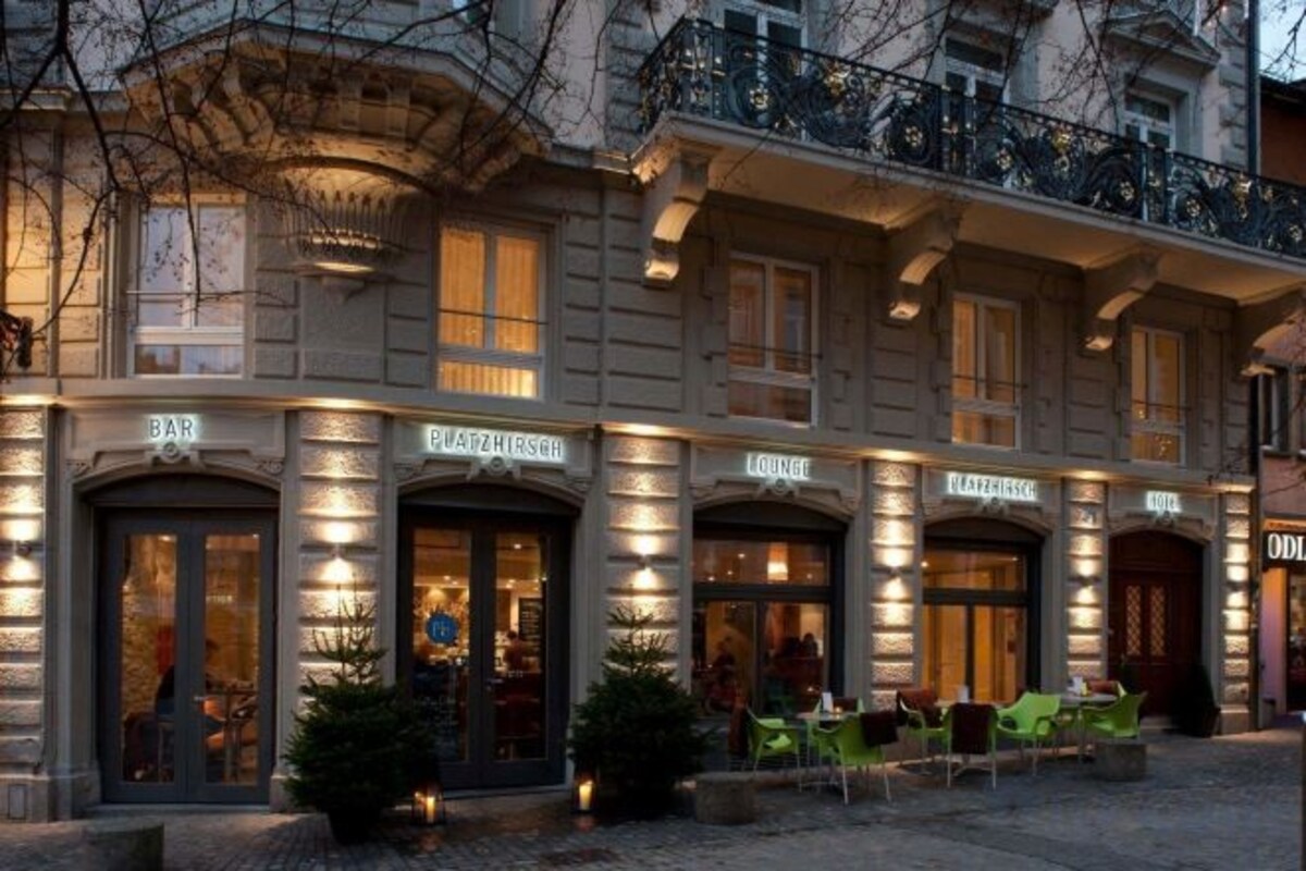 A building with multiple entrances labeled 'BAR,' 'LOUNGE,' and 'HOTEL.'