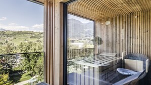 A balcony with a view of a green landscape and mountains. - Löwenhof (Varna)
