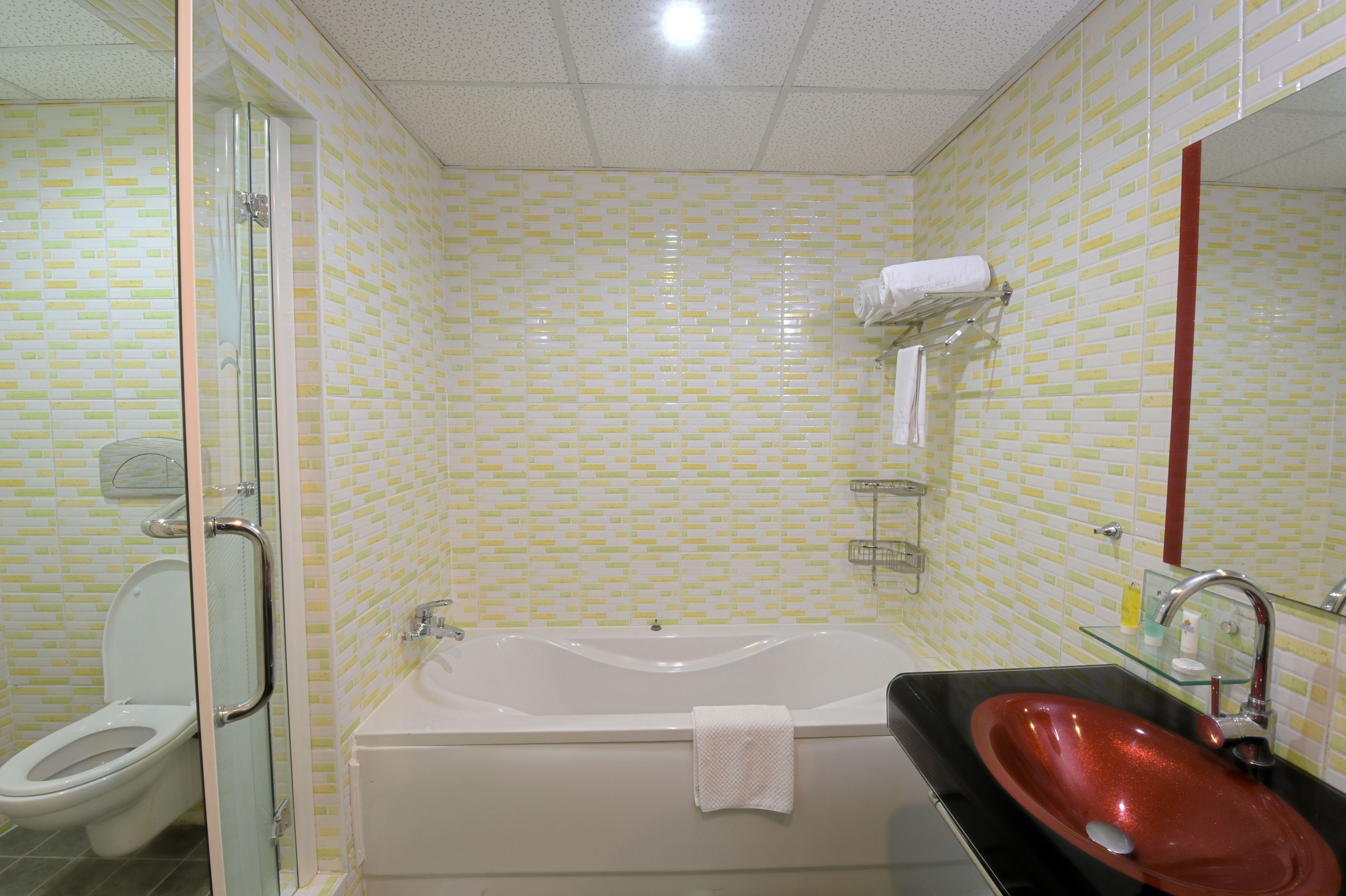 deluxe room | bathroom | deep-soaking bathtub, free toiletries, slippers, towels