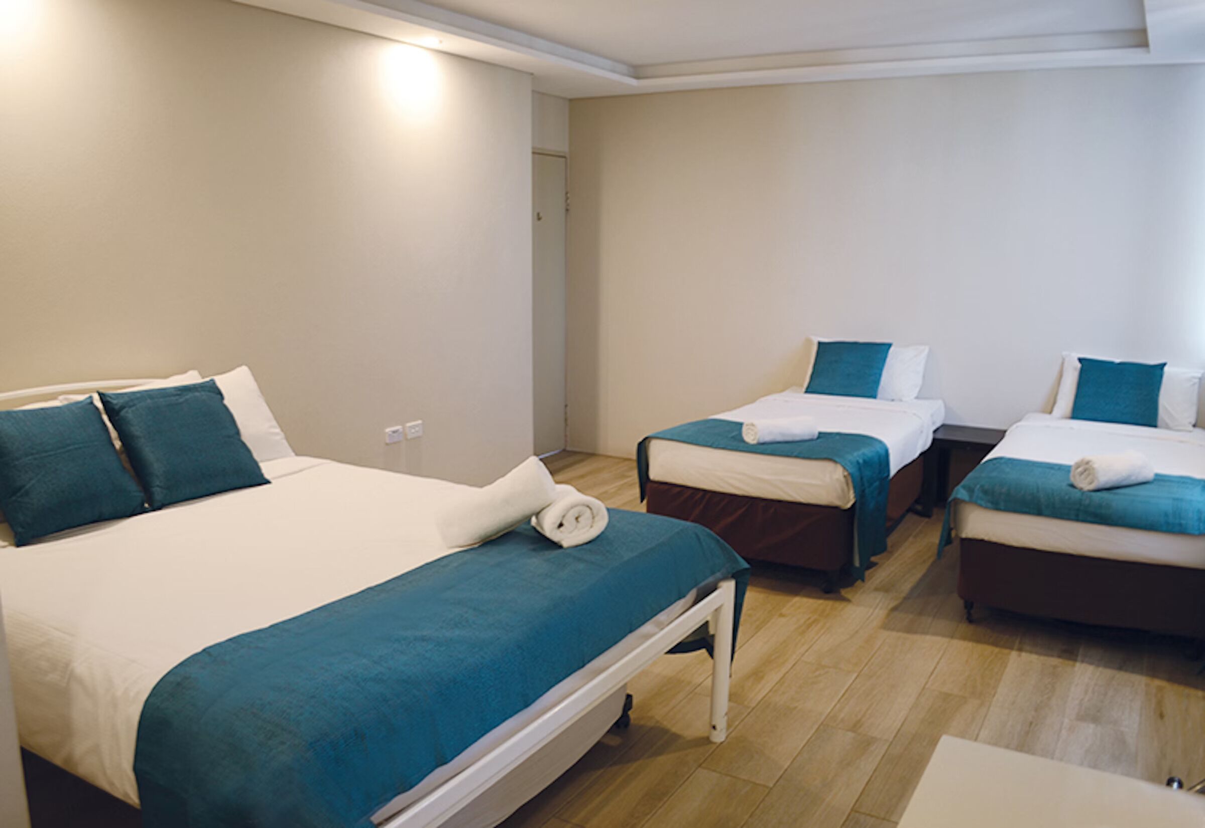 Deluxe Queen + 3 Singles Room | Minibar, desk, soundproofing, iron/ironing board