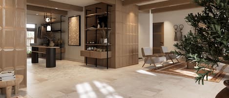 A spacious living area with a high ceiling, built-in wooden shelving, a large potted plant, and a seating area with a coffee table.