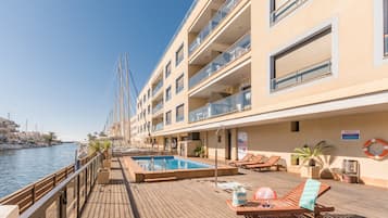 Seasonal outdoor pool, open 10:00 AM to 7:00 PM, sun loungers