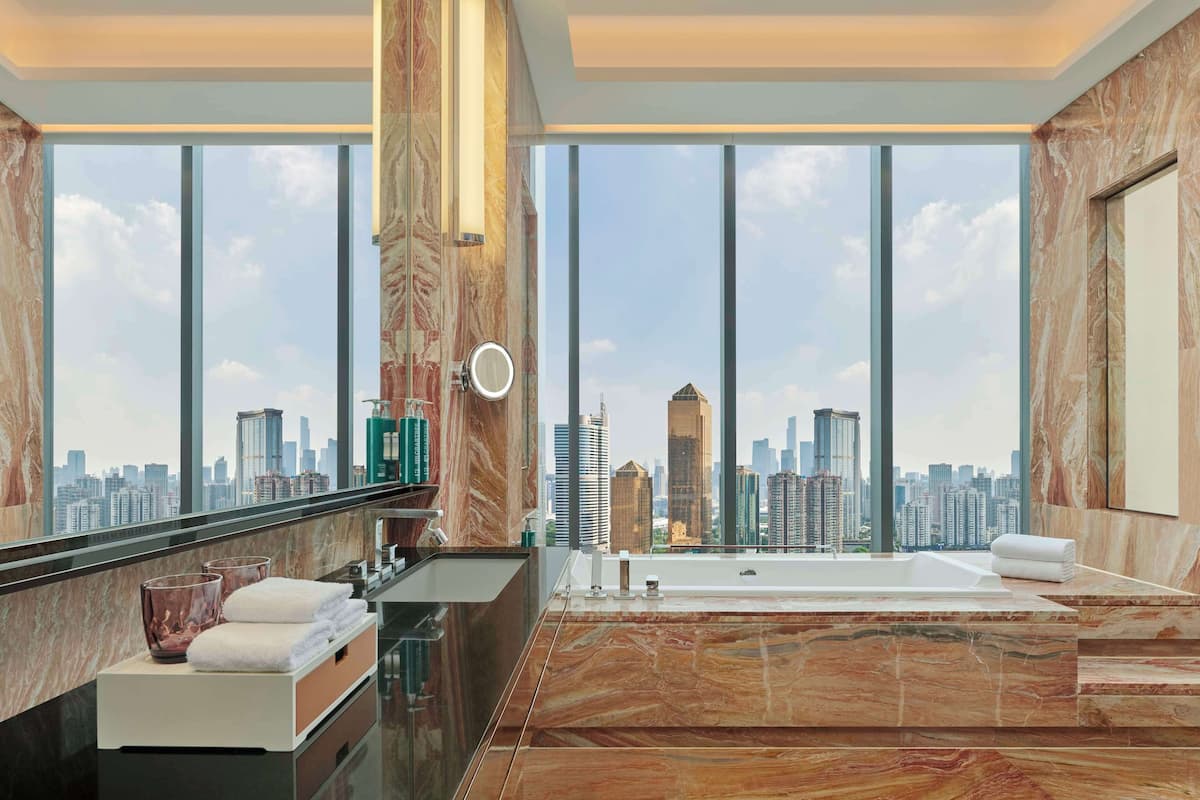 corner junior suite | bathroom | separate bathtub and shower, rainfall showerhead, free toiletries