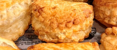 A variety of pastries on a newspaper.