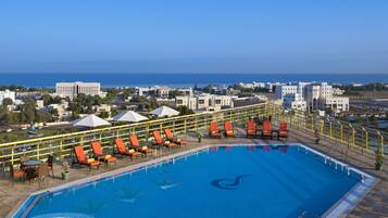 Outdoor pool, open 8:00 AM to 8:00 PM, pool umbrellas, sun loungers