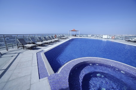 Outdoor pool, open 8:00 AM to 8:00 PM, pool umbrellas, sun loungers