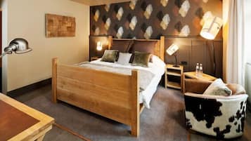 Luxe beddengoed, een kluis op de kamer, een bureau, geluiddichte muren