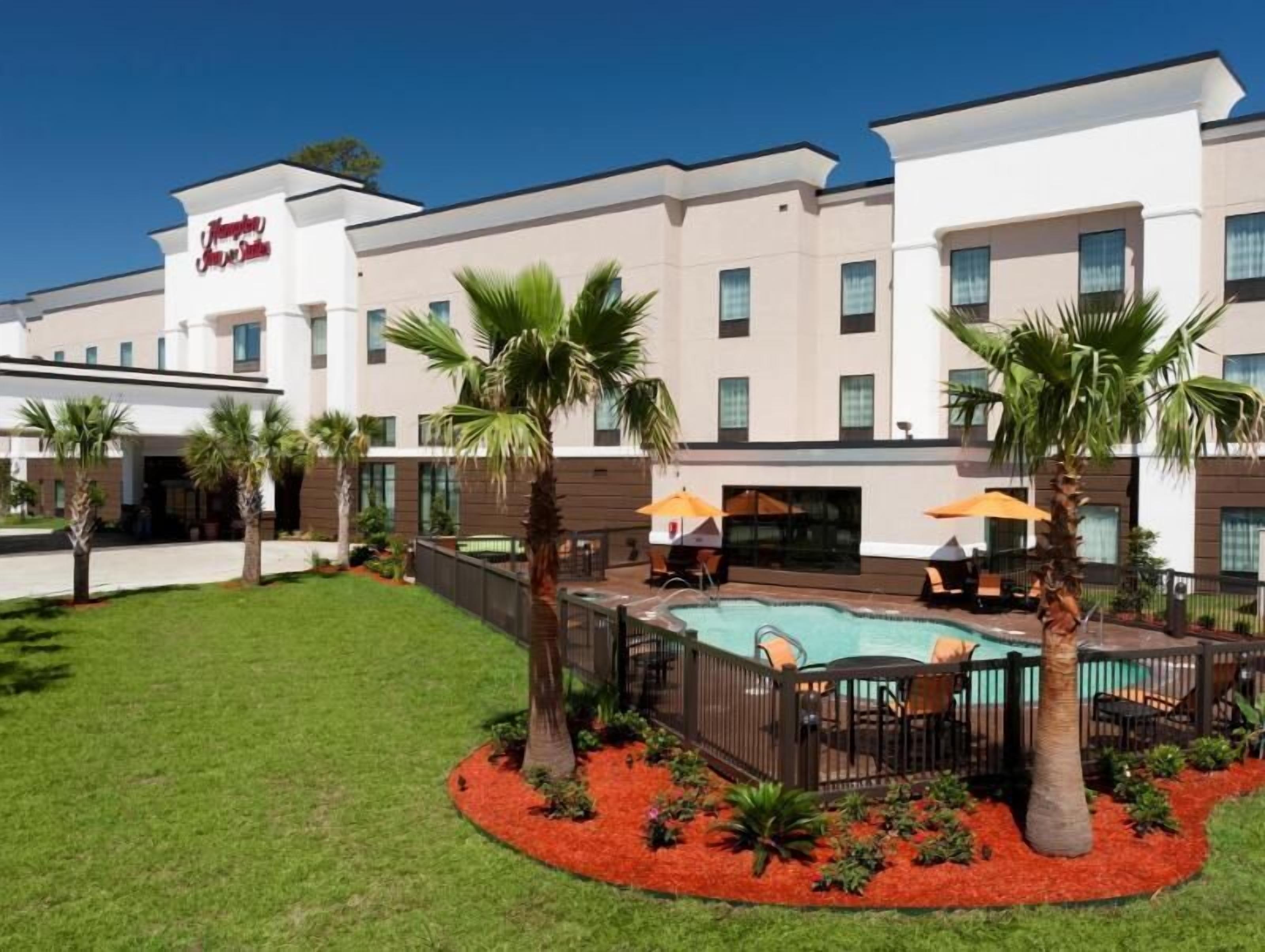 Pool | Outdoor pool, open 6:00 AM to 6:00 PM, pool umbrellas, sun loungers