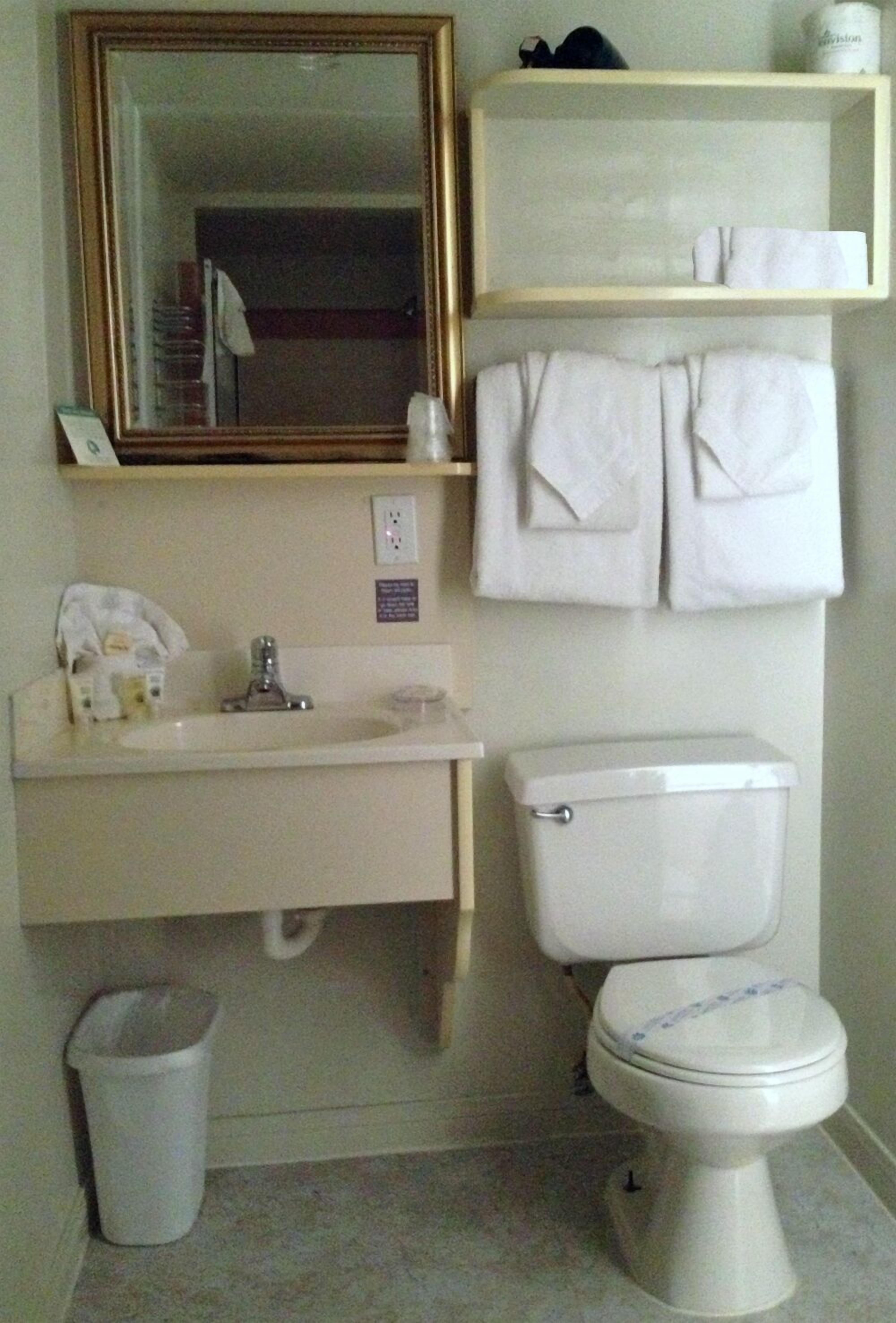 designer toiletries, hair dryer, towels